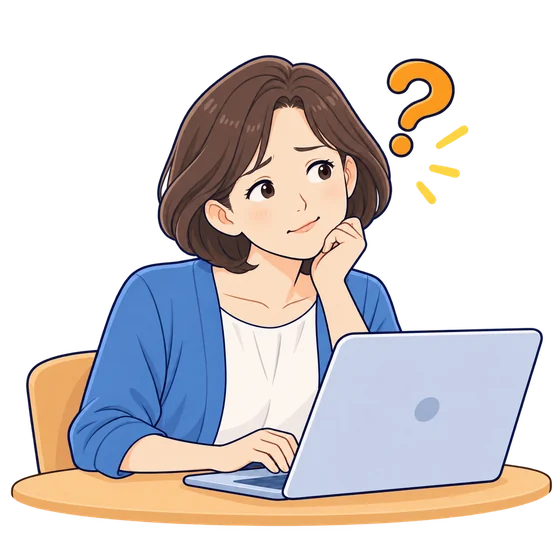 パソコンの前で困っている女性